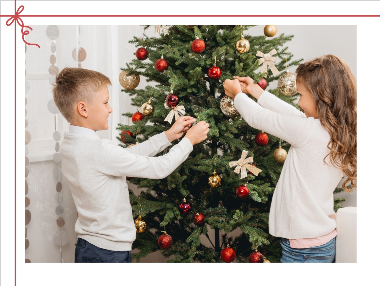 Christmas card with children decorating the tree